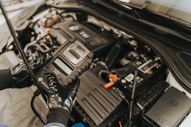 Car battery inspection and replacement at JC Auto Repair