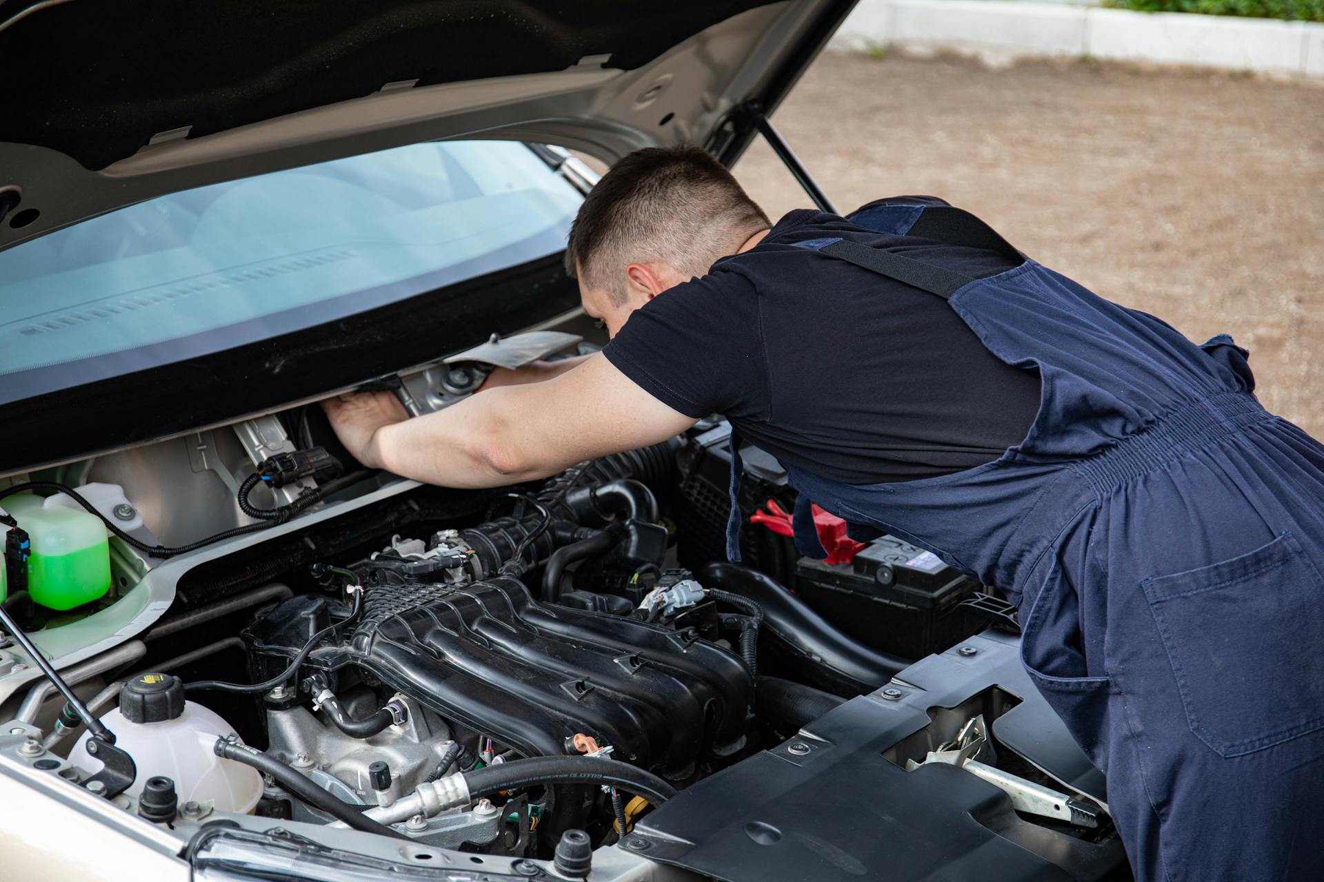 JC Auto Repair mechanic inspecting engine components in Oklahoma City