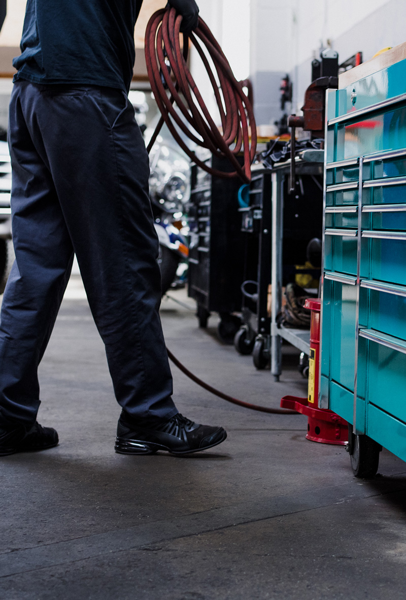 Mechanic organizing tools in an auto repair shop in Oklahoma City